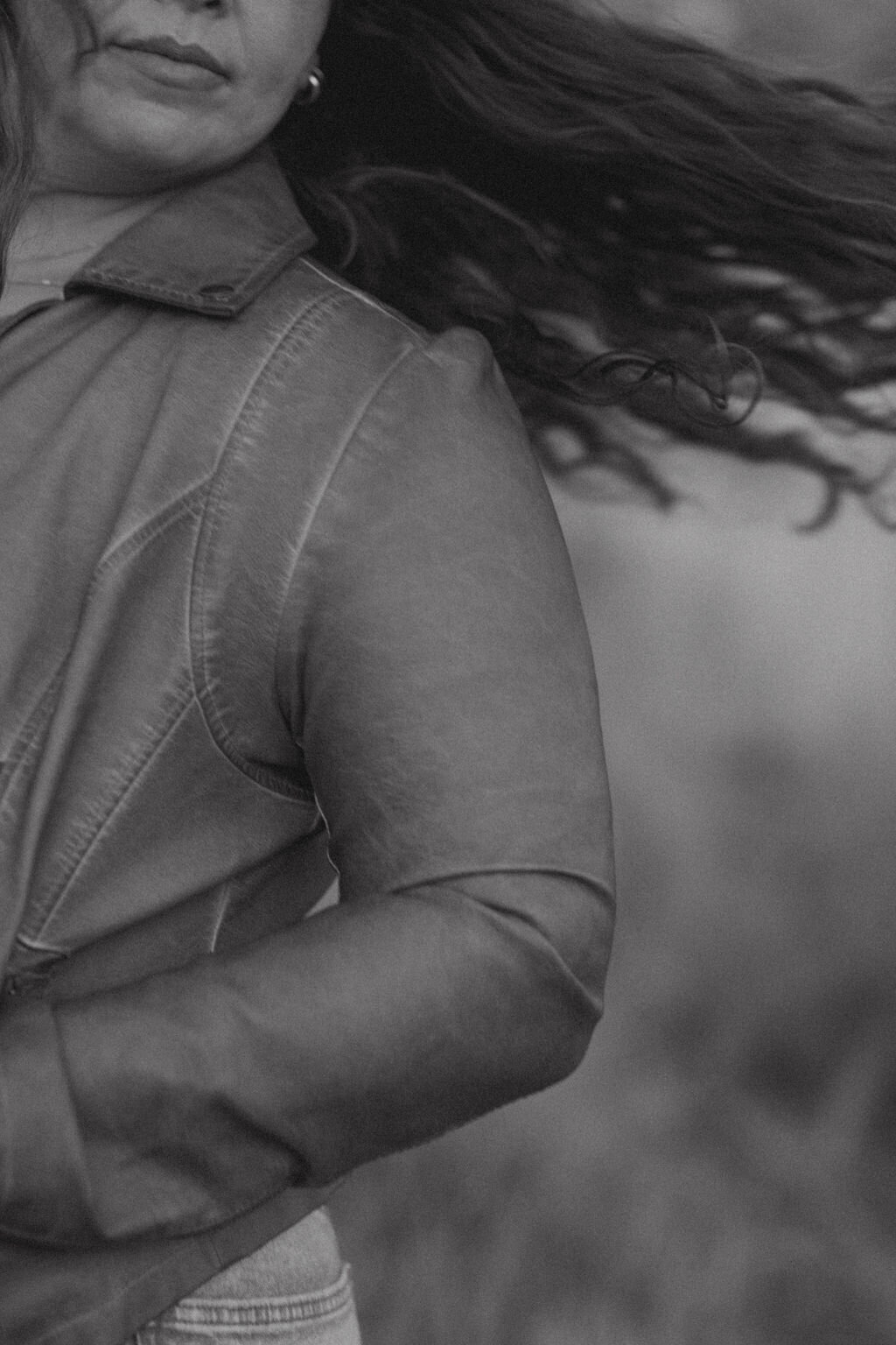 Woman in leather jacket with hair movement