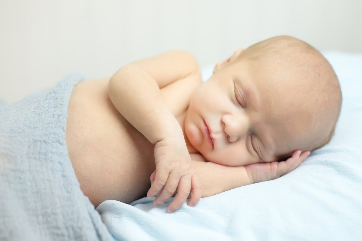 Newborn baby boy sleeping in portrait in Kennebunk Maine
