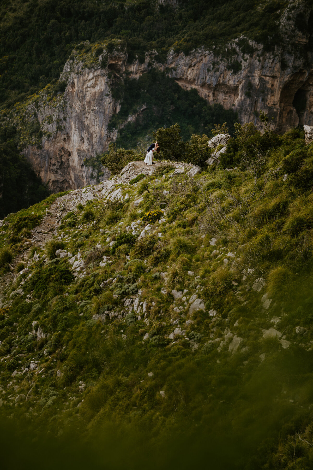 Couple running on a trail together.