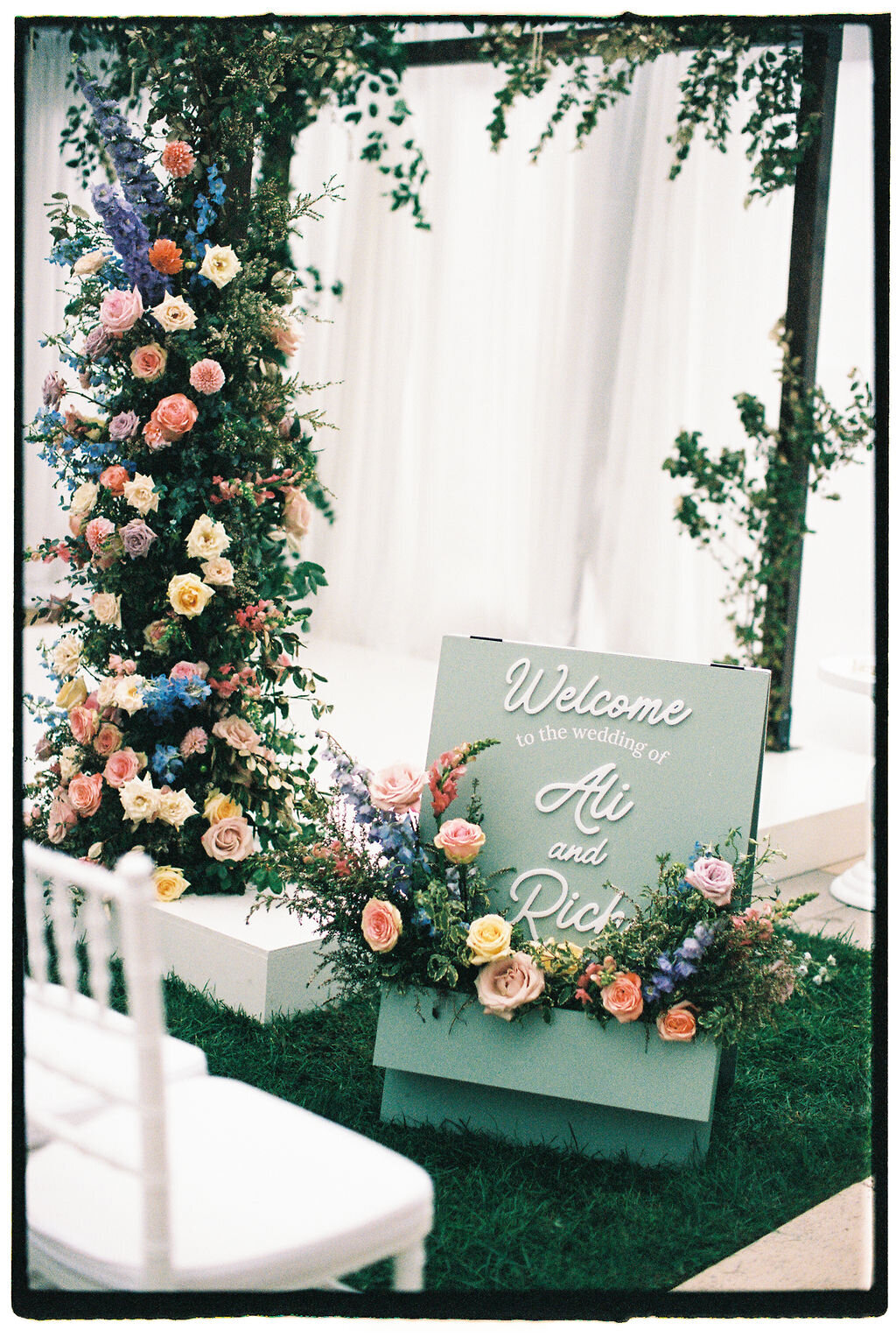 Wedding welcome sign with pastel flowers