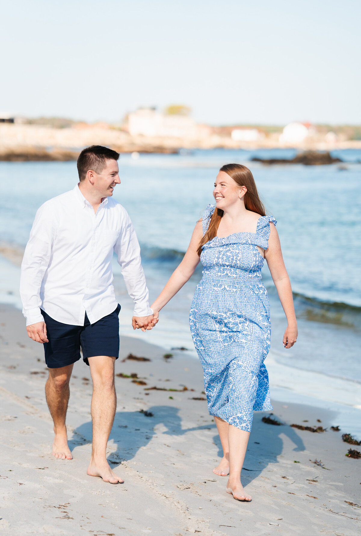 Coastal New Castle NH engagement photography featuring candid emotional portraits.