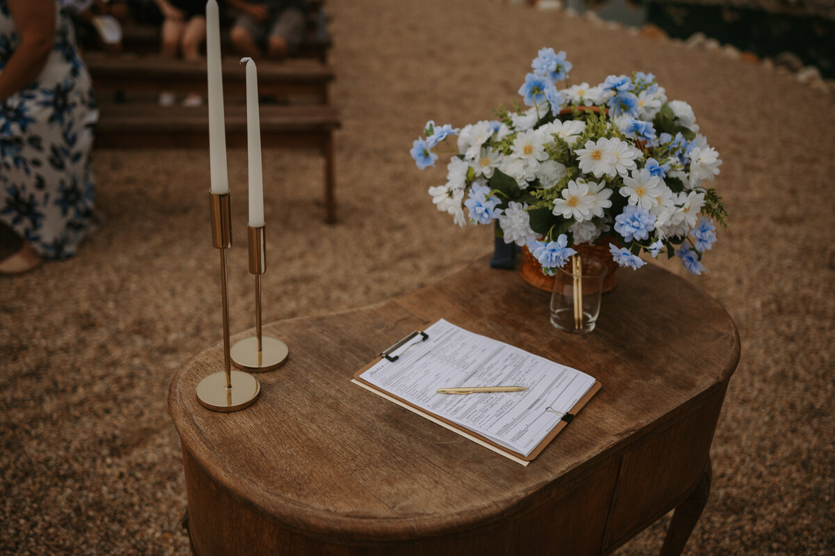 ceremony table florals and documents 