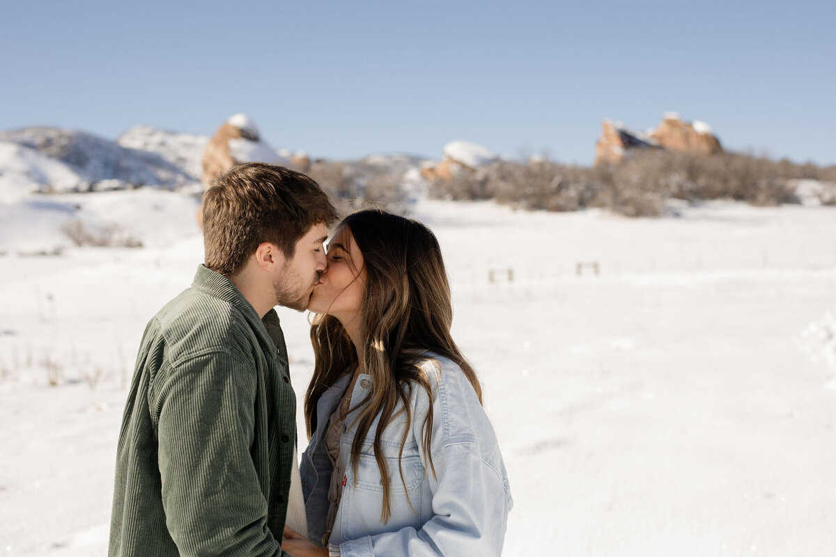 Couple kissing in snow