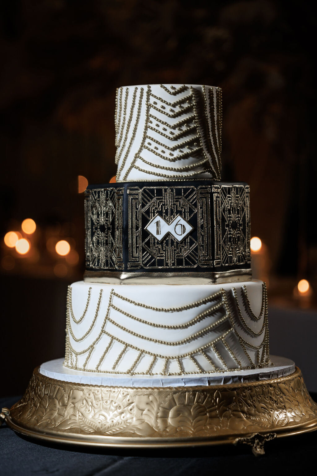 Black, white, and gold tiered sweet 16 birthday cake by Swiss Chalet in Morristown, NJ