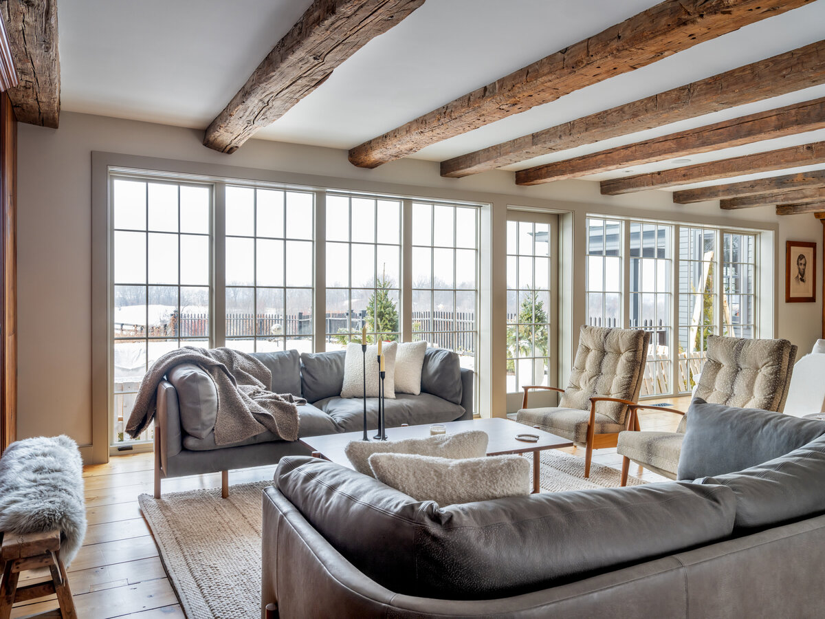 wall lined with large windows and furniture