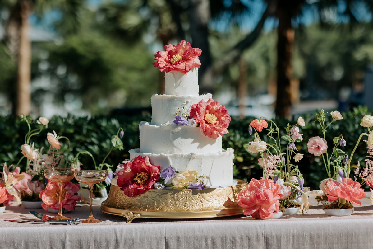 white-wedding-cake-gold-stand-bright-floral