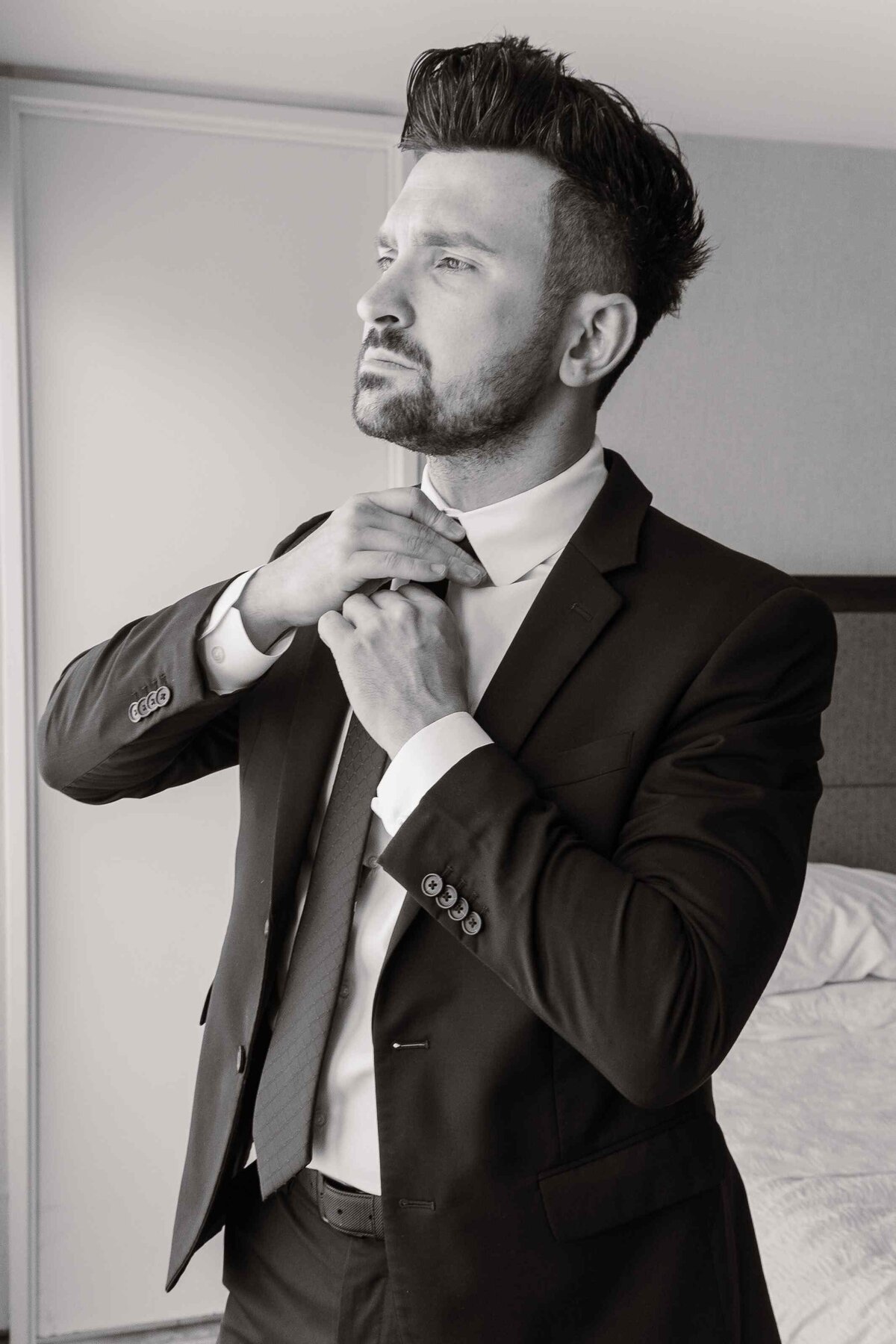 12-greyscale-groom-adjusting-tie