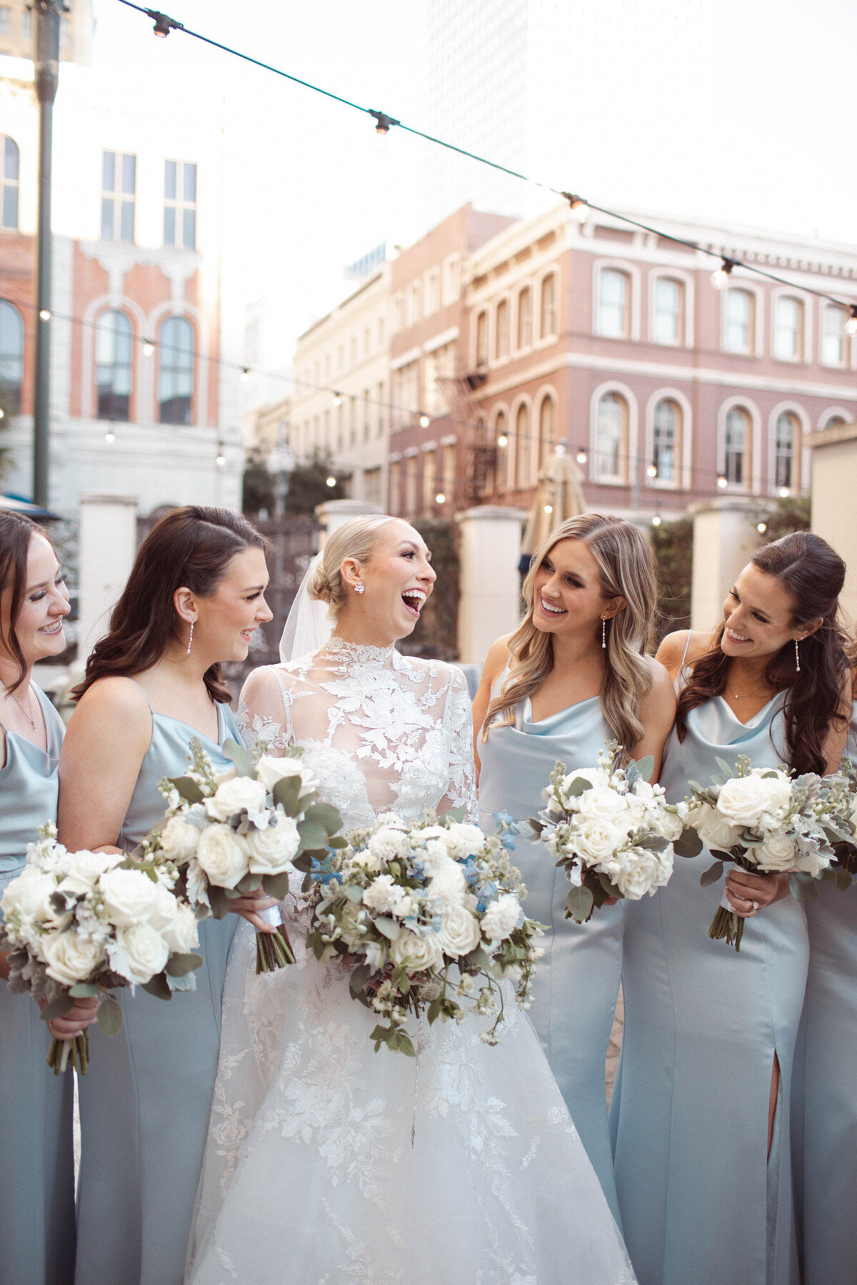 bridal party standing outside the NOPSI hotel