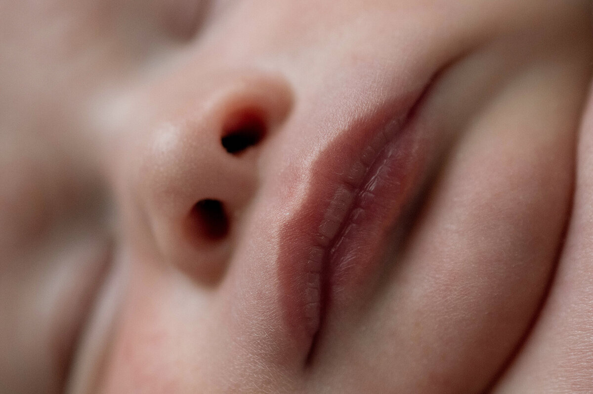 Details of a newborn baby's lips while sleeping