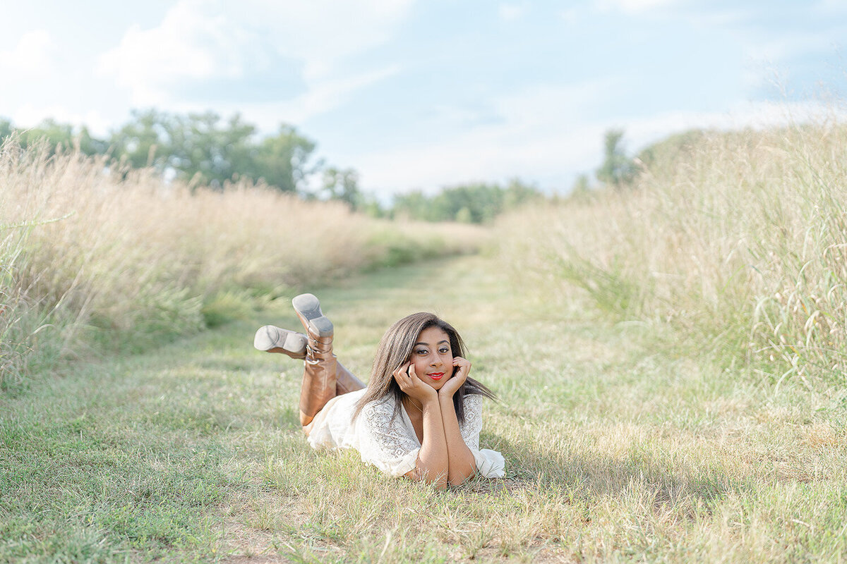 girl in a field with tall grass during Marshall, VA senior picture