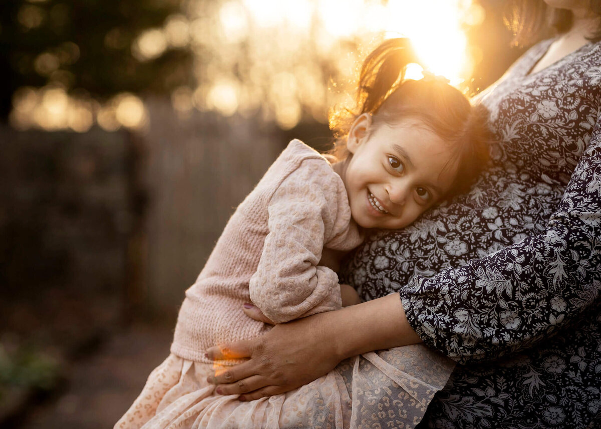 NJ Maternity photos of little girl with her mom's belly