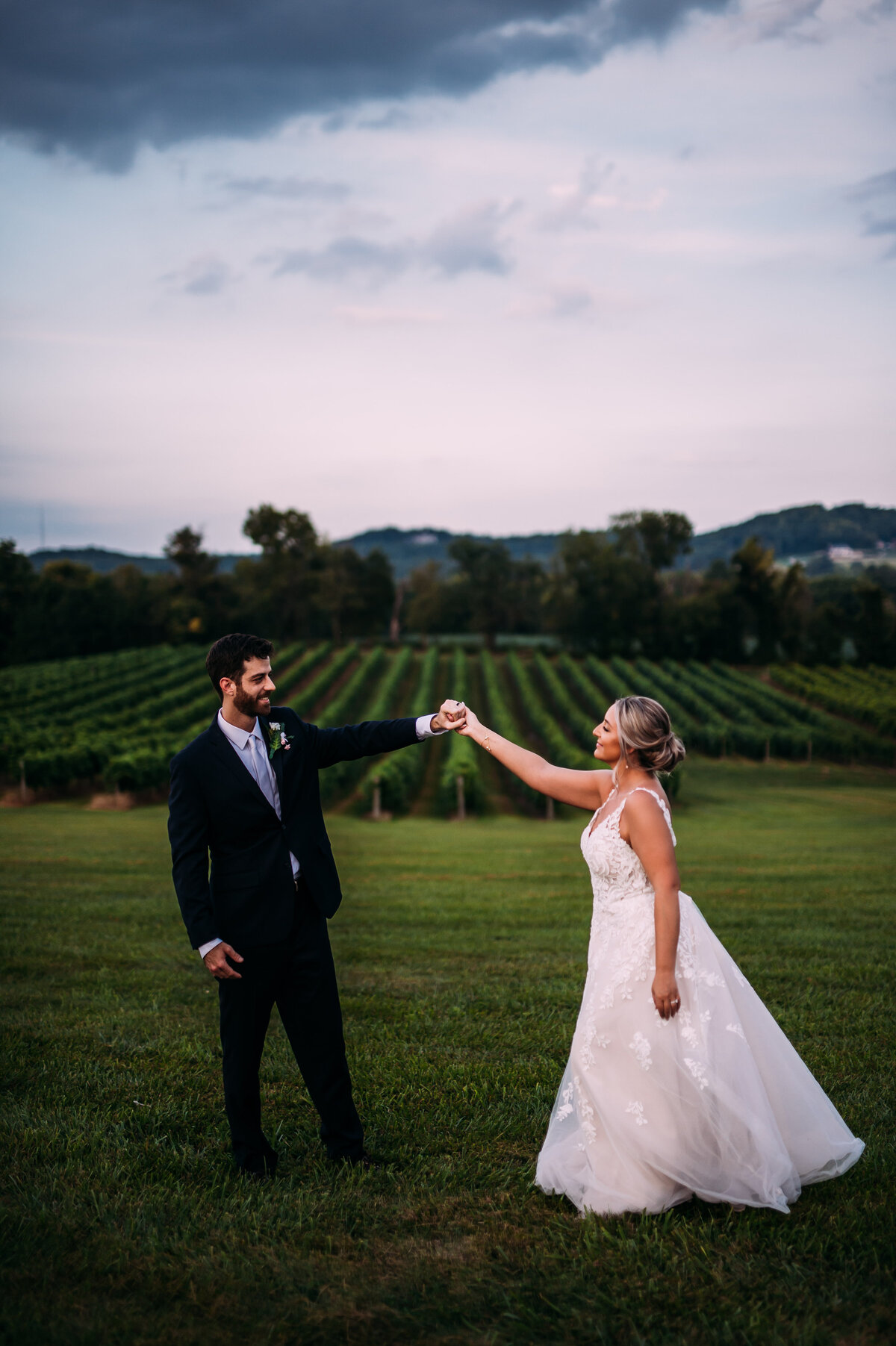 bride groom dancing in vineyard in Missouri
