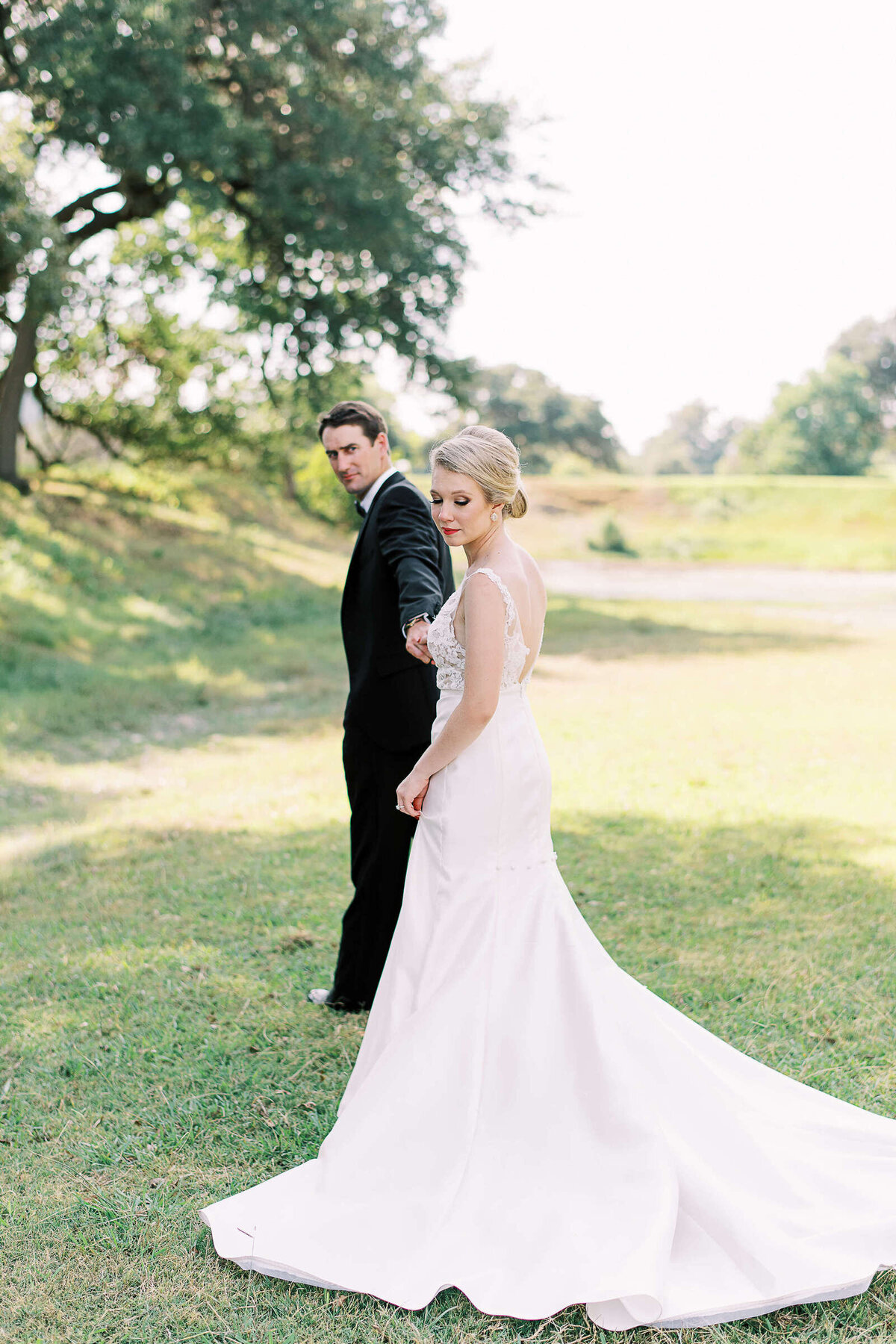 Bride and groom go on walk in the Texas hill country