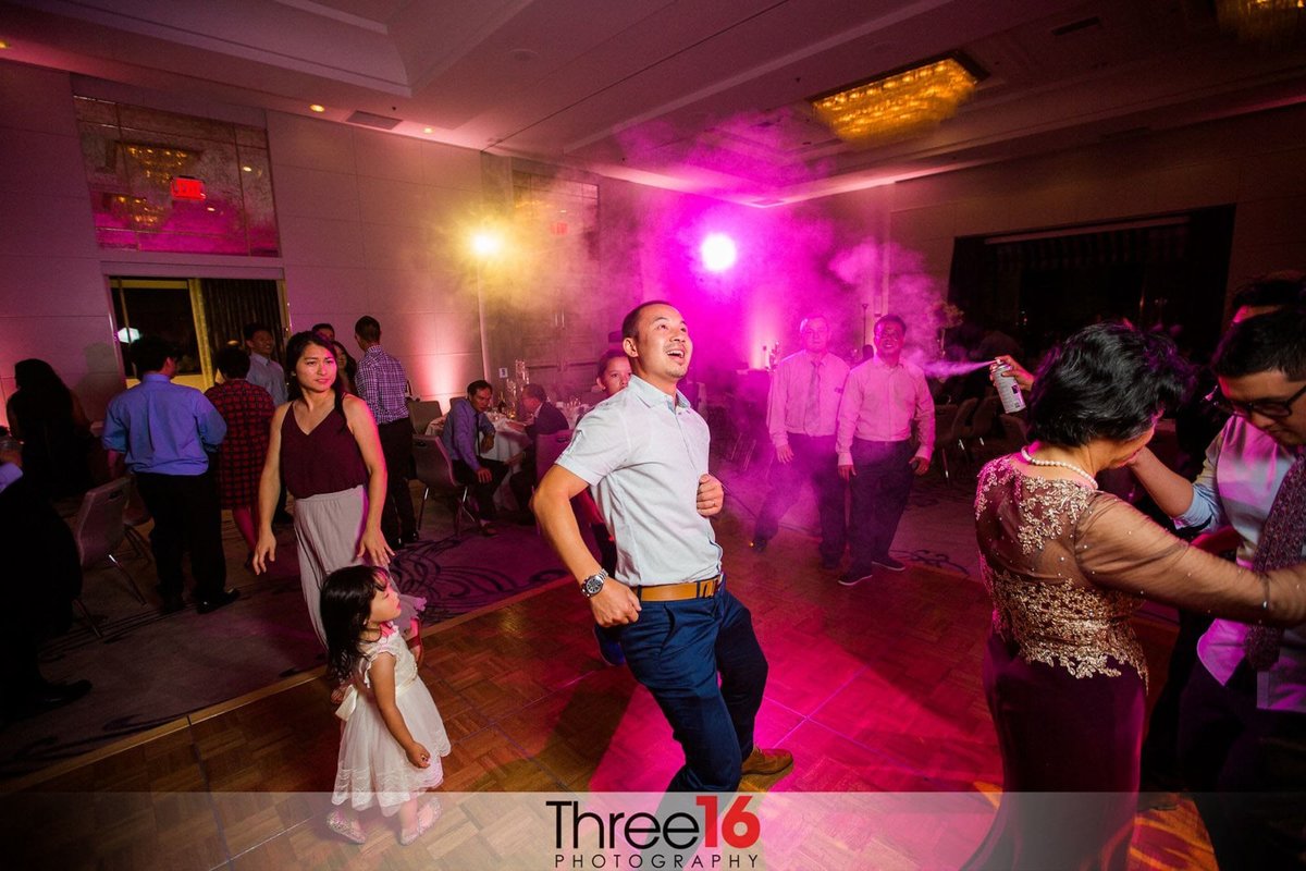 Guests dance at a wedding reception