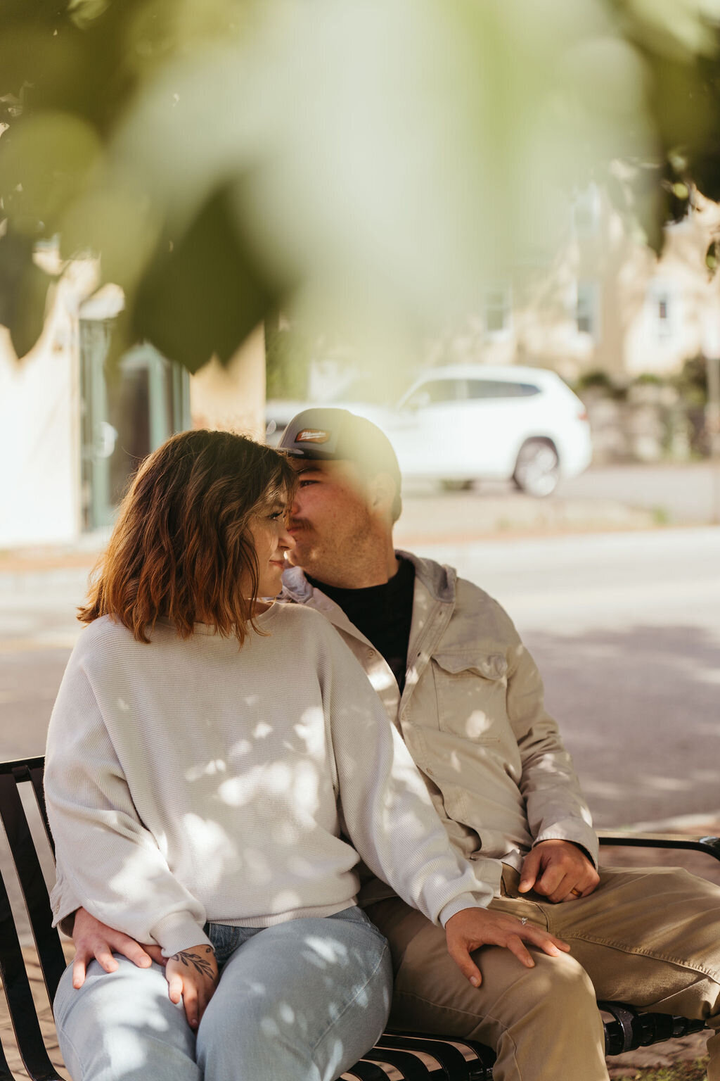 Photo of couple sitting on bench together