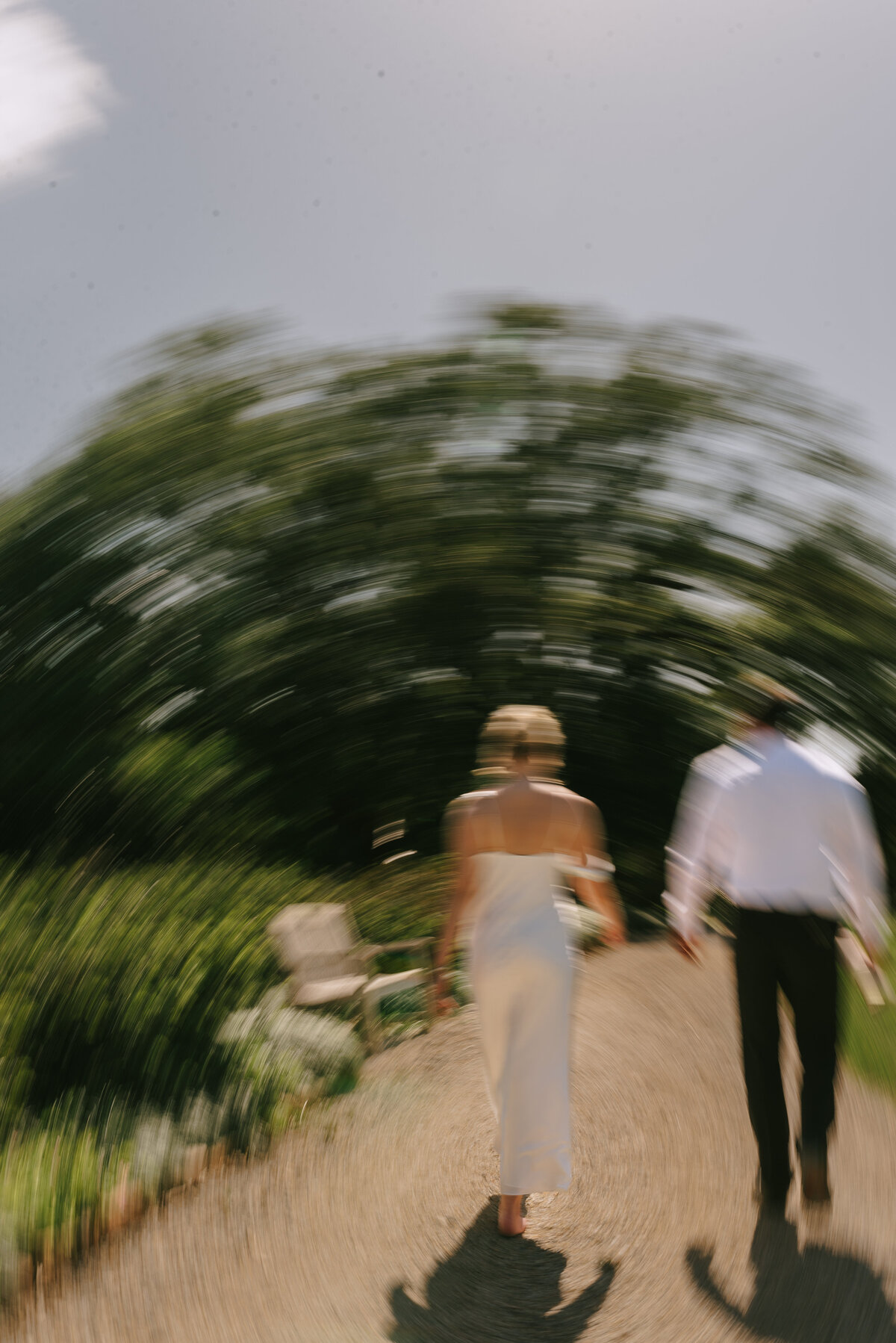 Blurred image of wedding couple walking to show motion blur.
