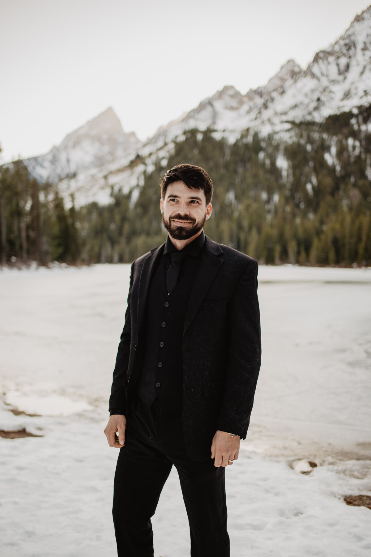 Jackson Hole Photographers capture groom smiling during portraits