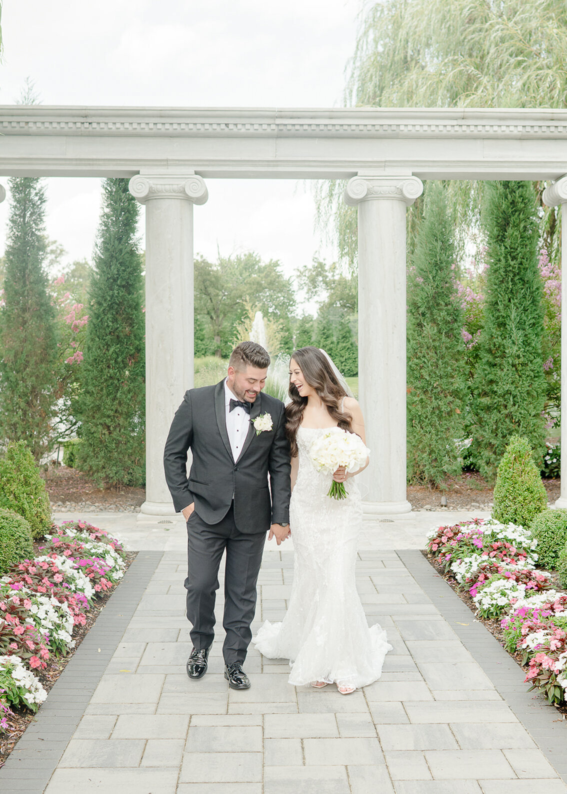 couple-walking-at-florida-wedding-garden-