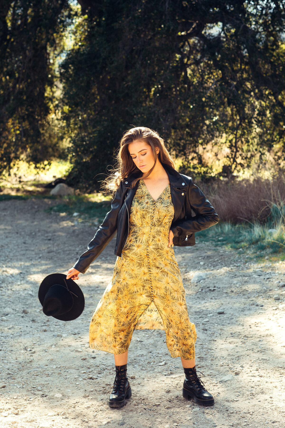 Portrait Photo Of Young Woman In Black Boots Carrying Her Cowboy Hat Los Angeles