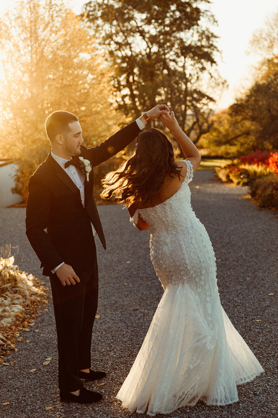 groom-twirling-bride-outside