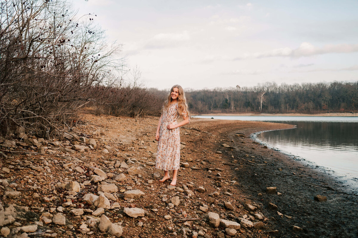 teen girl smiling next to Table Rock lake
