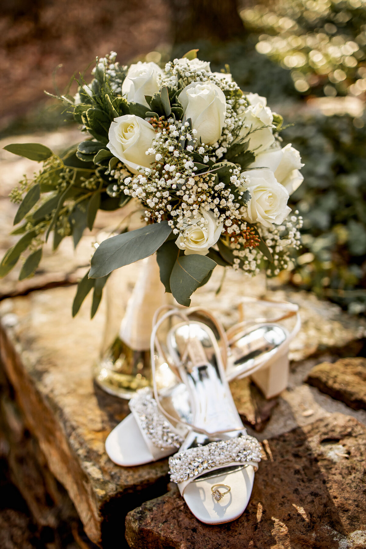 bridal shoes, ring, and flowers