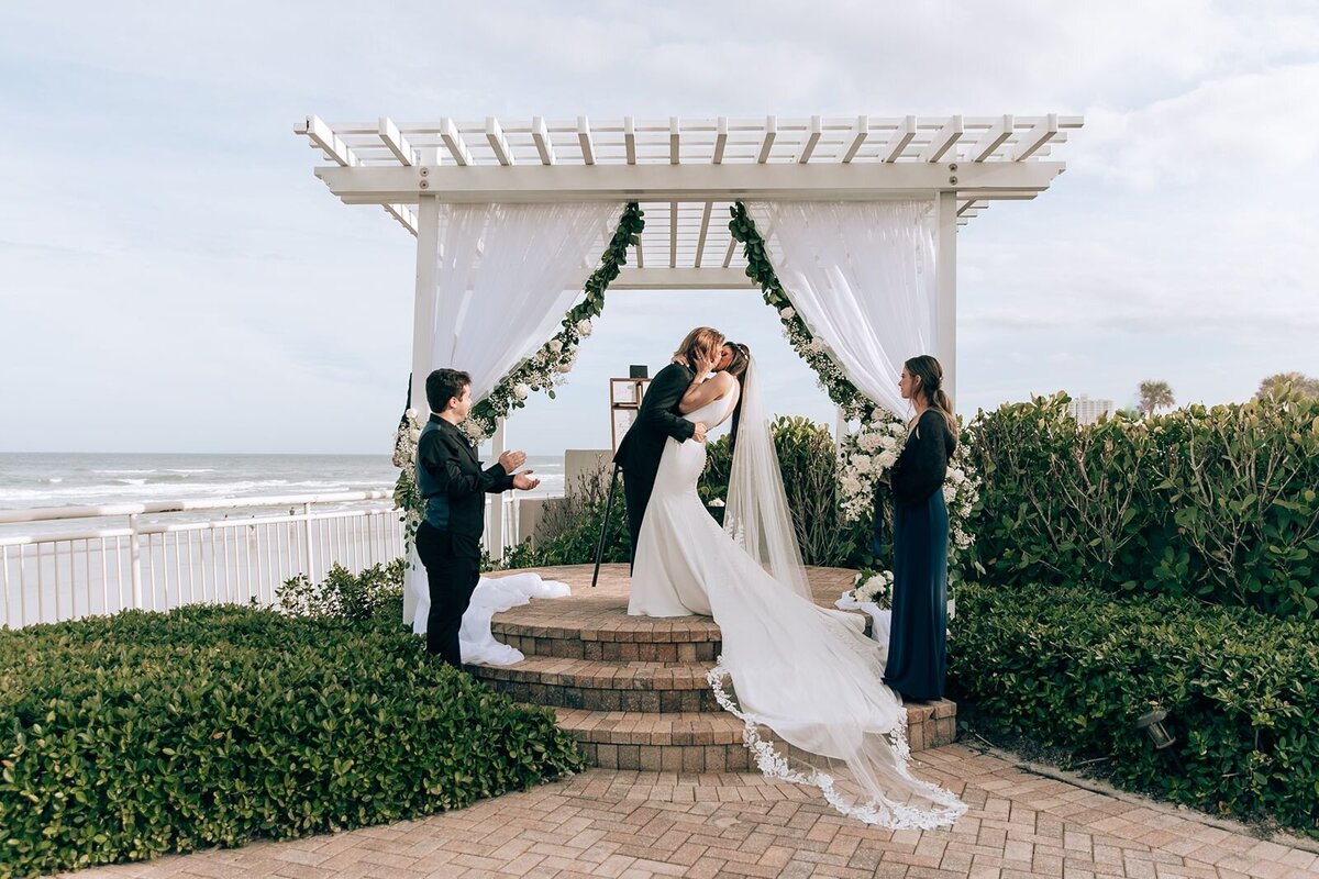 bride and grooms first kiss at the Shore Resort in Daytona Beach