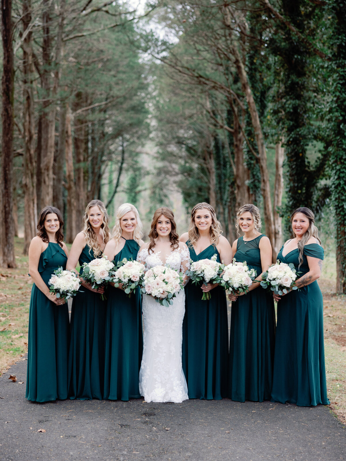 A bride stands with her bridesmaids