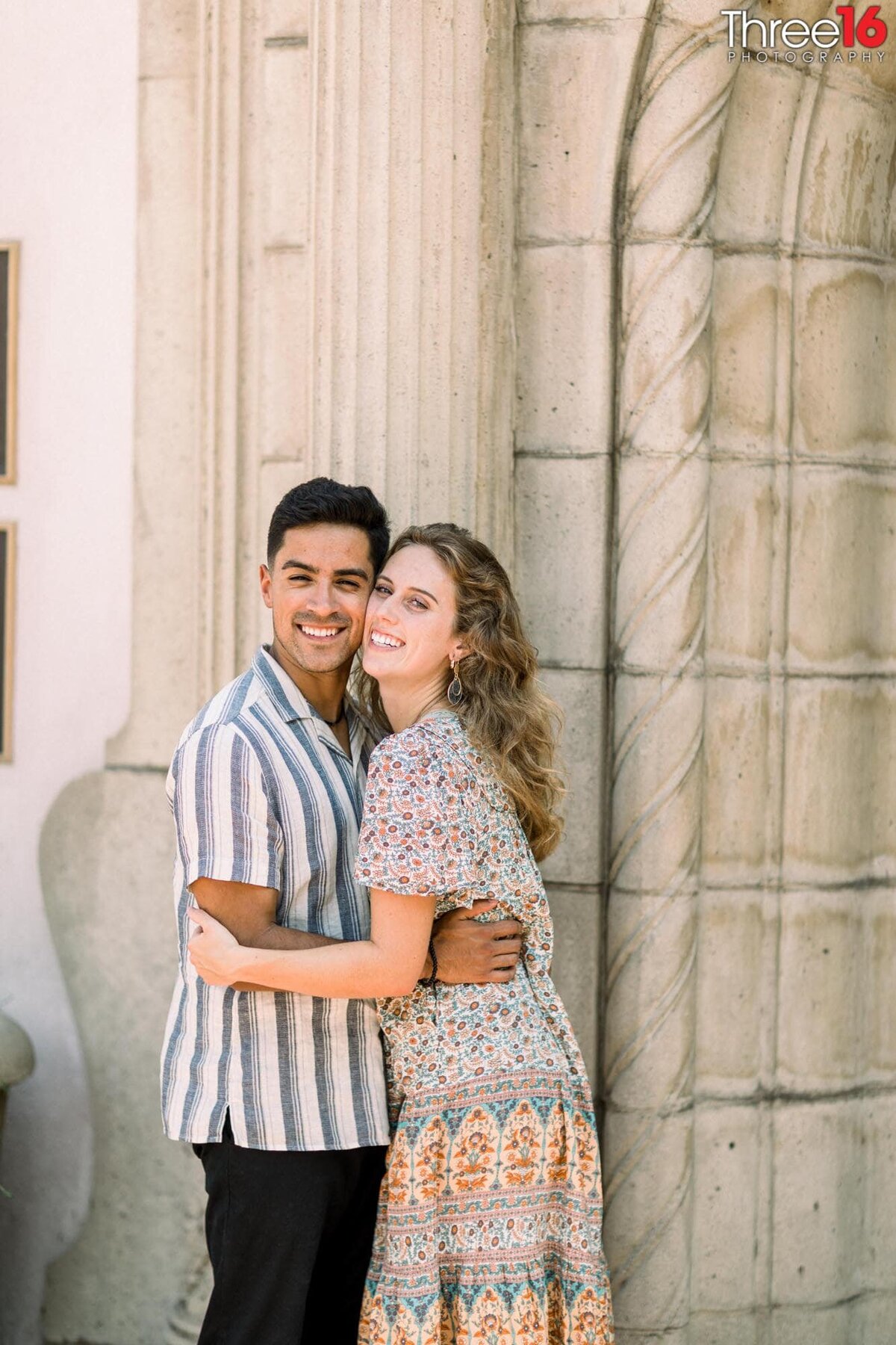 Big smiles for engaged couple during their Claremont Train Station engagement photo shoot