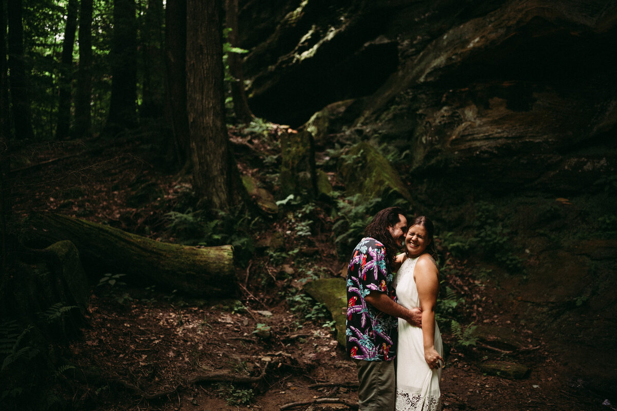 Couple laugh in the Hockig Hills woods after getting eloped, photographer Paige Mireles