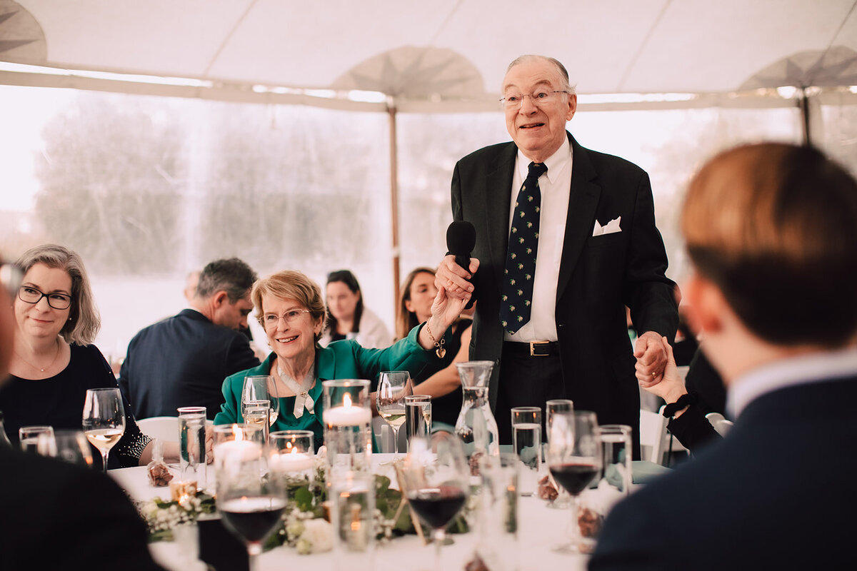 Grandpa gives a speech at wedding reception