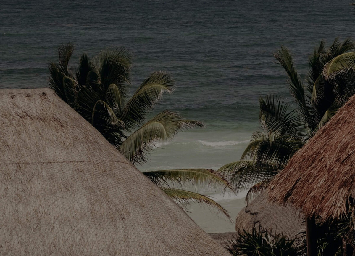 Picture overlooking the ocean and beach from a deck