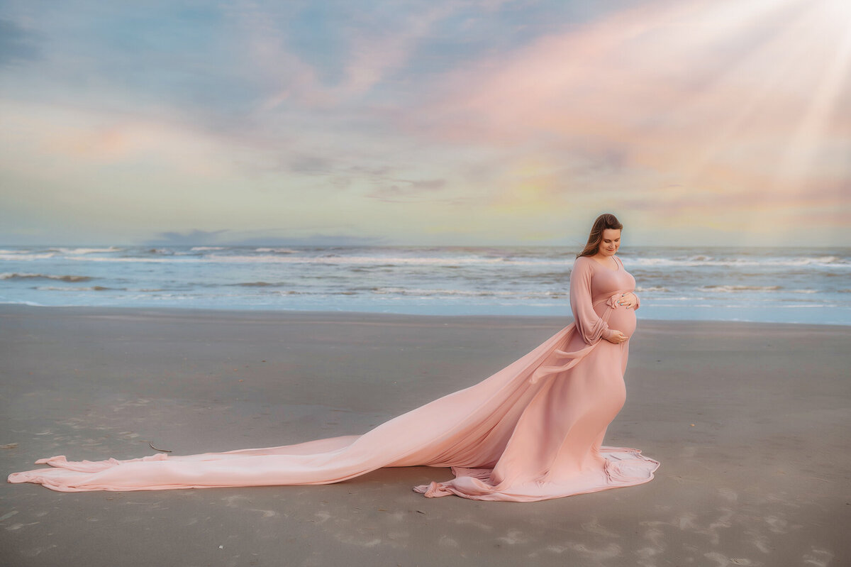 Expectant mother poses for Maternity Photoshoot on the Beach in Charleston, SC.