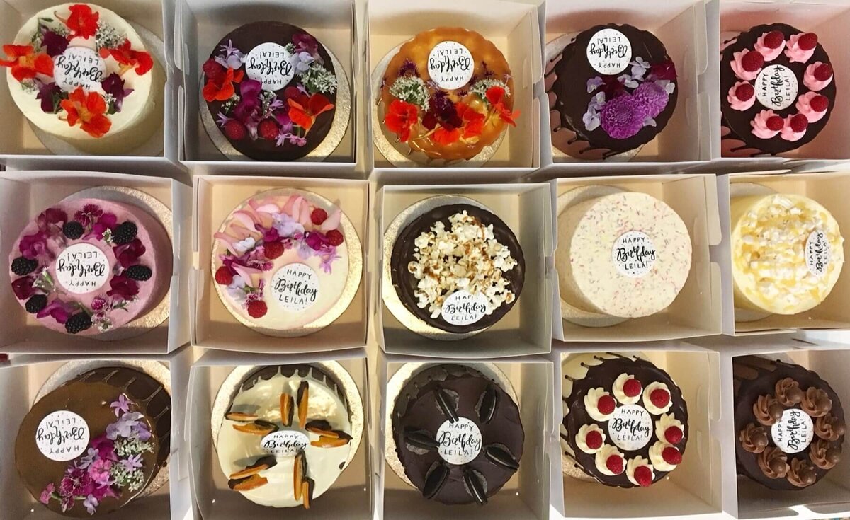 a box of 15 individual mini birthday cakes