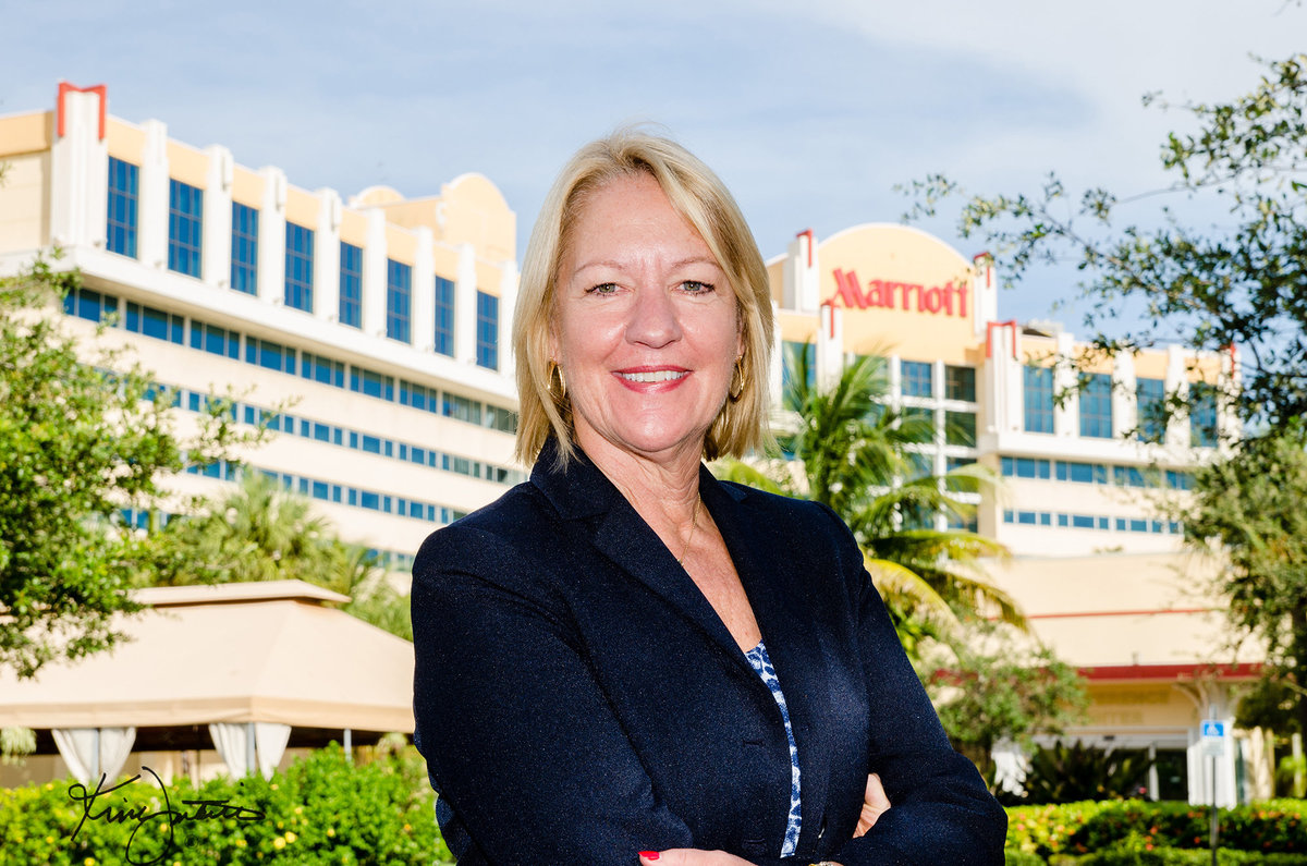 General manager headshot in front of Marriott Hotel