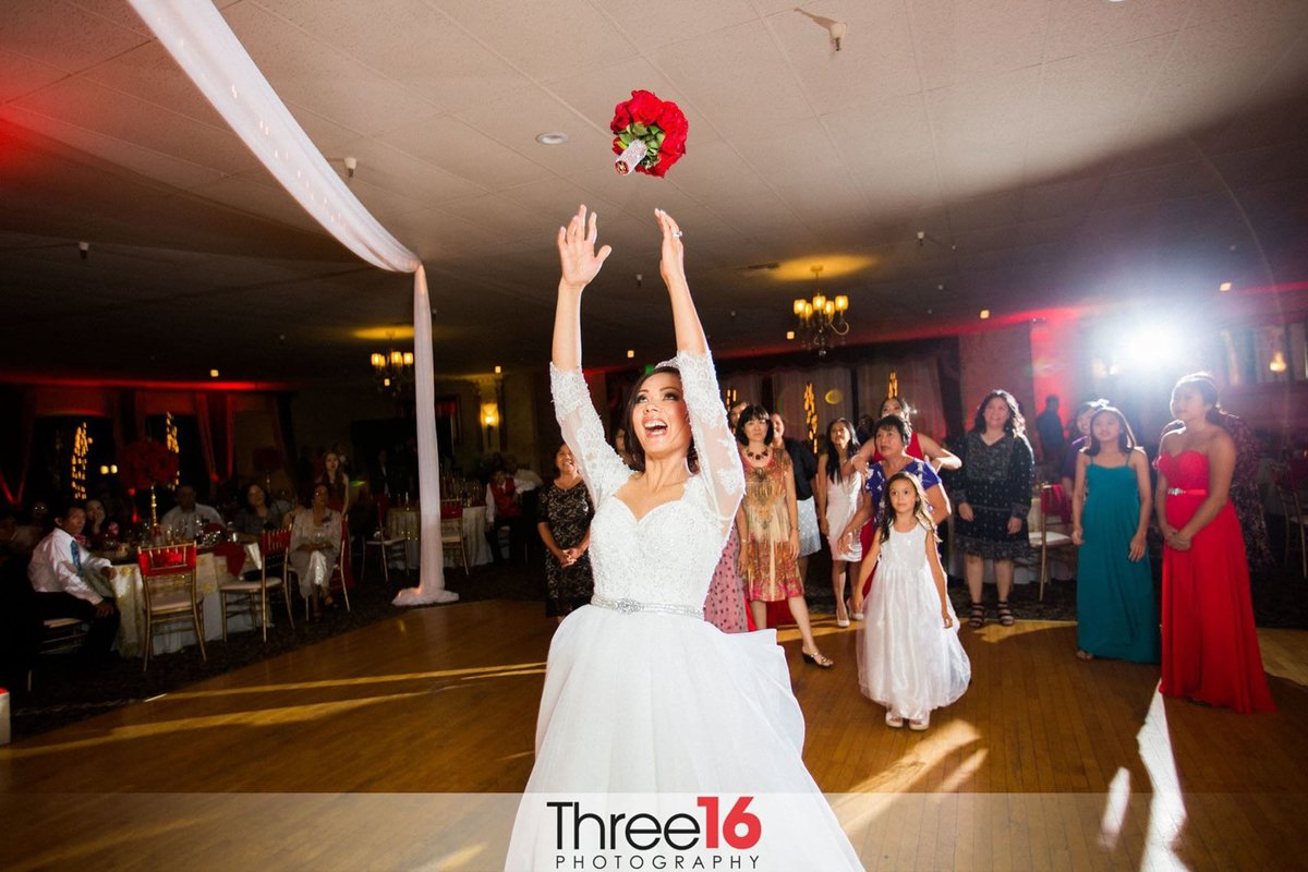 Bride tossing the bridal bouquet