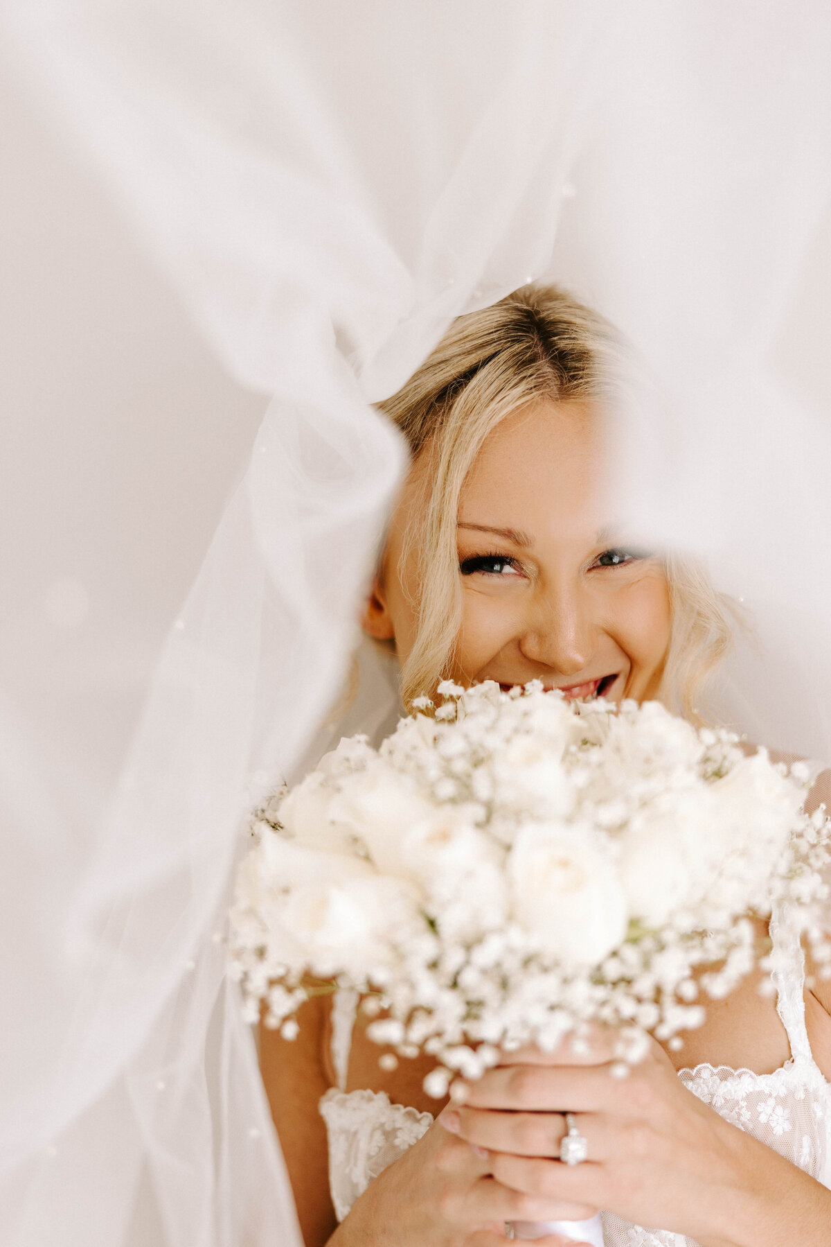 Getting ready photo of bride day of boudoir session. Cancun, Mexico