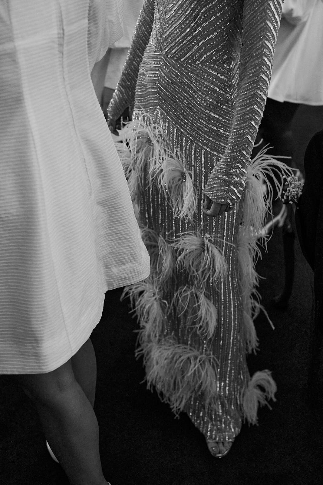 The fine details of a dress which the bride wore for the party after the ceremony at the grounds of Sydney University.