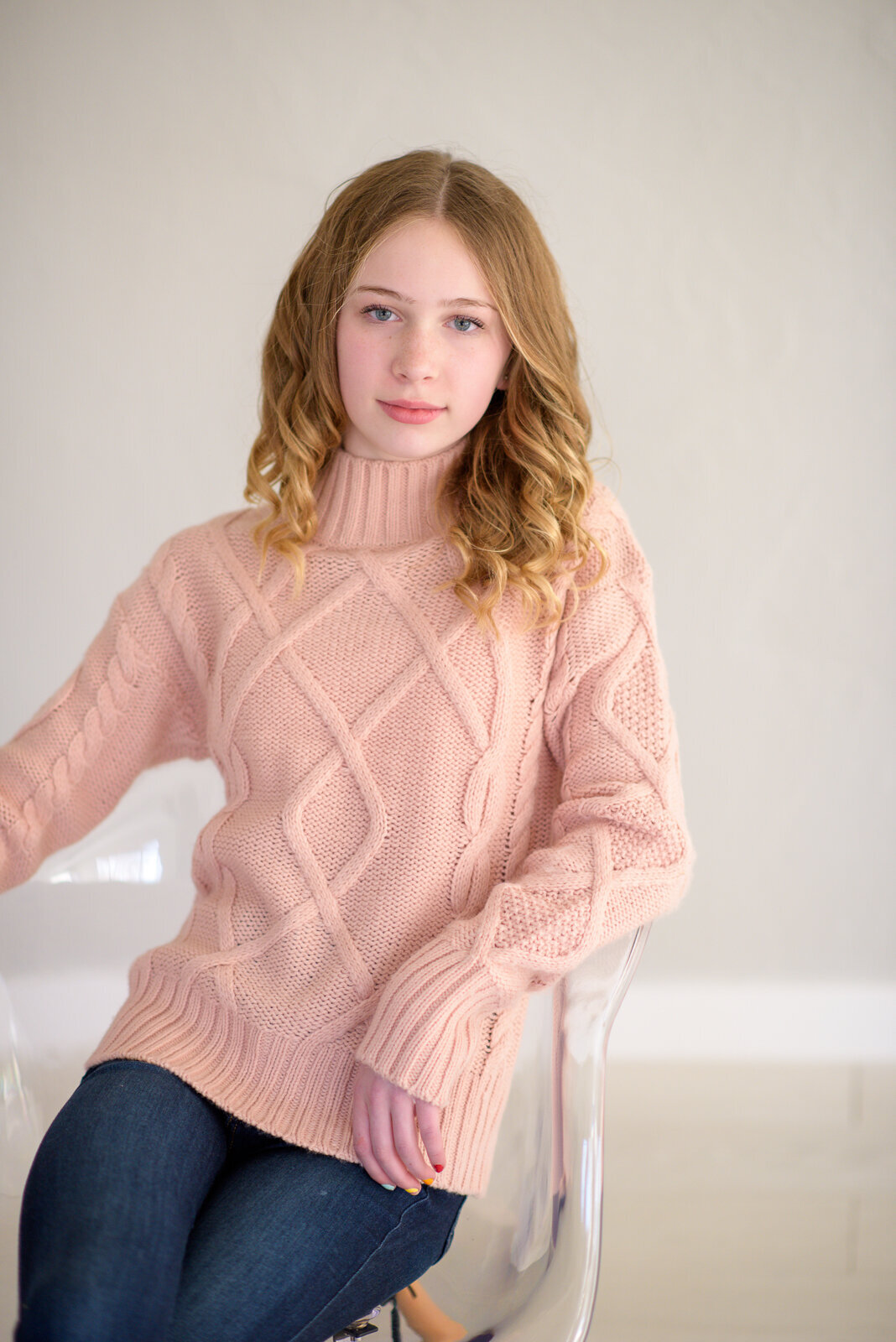 Tween girl sitting in photo studio in Boise.