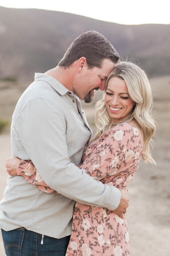 couple-hugging-and-laughing-mission-trails-san-diego