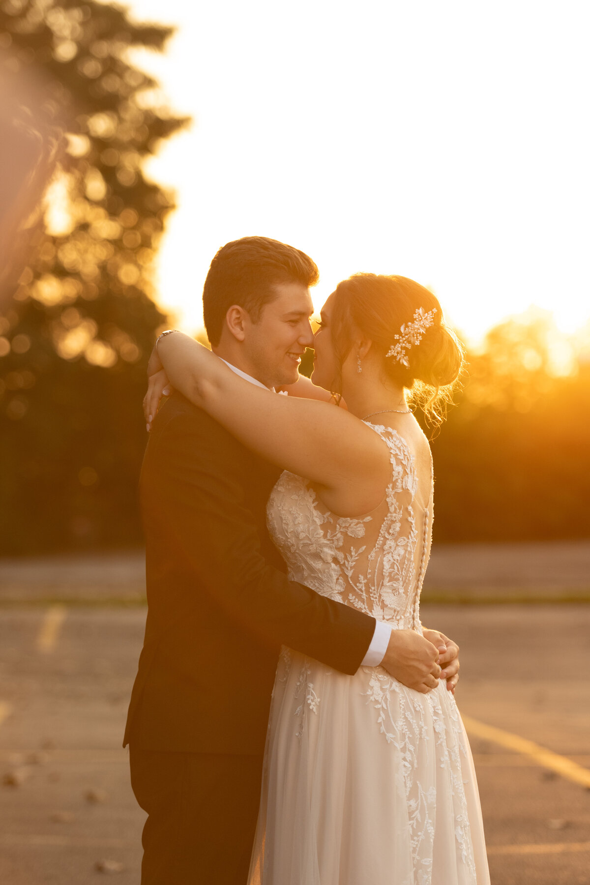 Happy couple embrace and hug each other during their couples session on their wedding day. Located in Akron, Ohio. Photographed by Aaron Aldhizer
