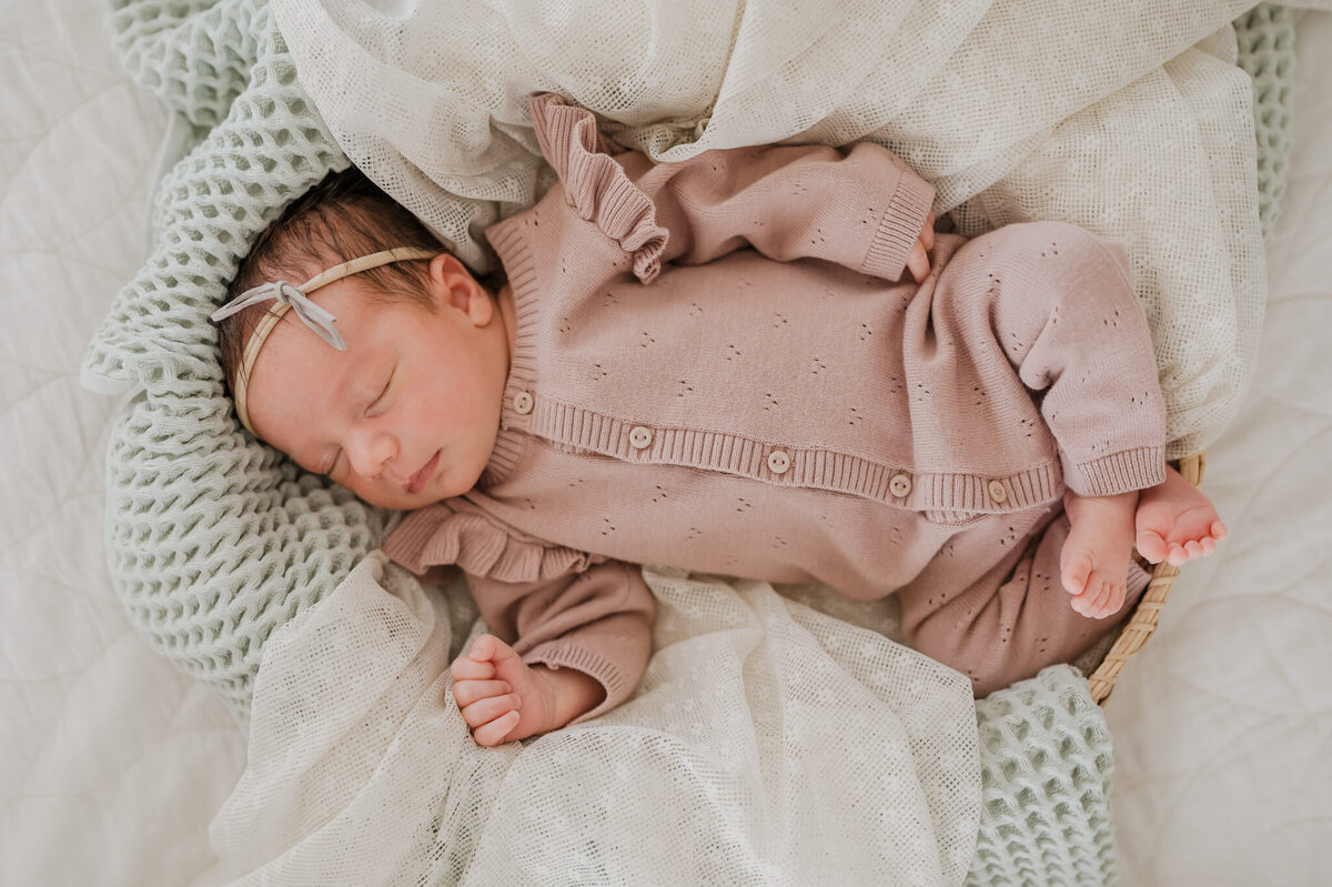 Overhead portrait of a baby girl. Newborn photography by Cassey Golden.