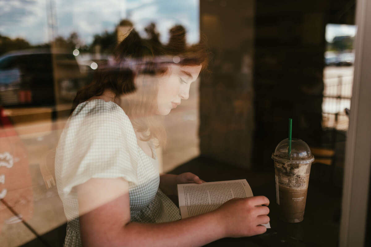 photograph of senior sitting in Books-A-Million bookstore reading novel