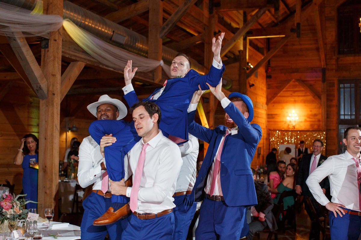 Austin wedding photographer addison grove wedding photographer groomsmen throwing groom