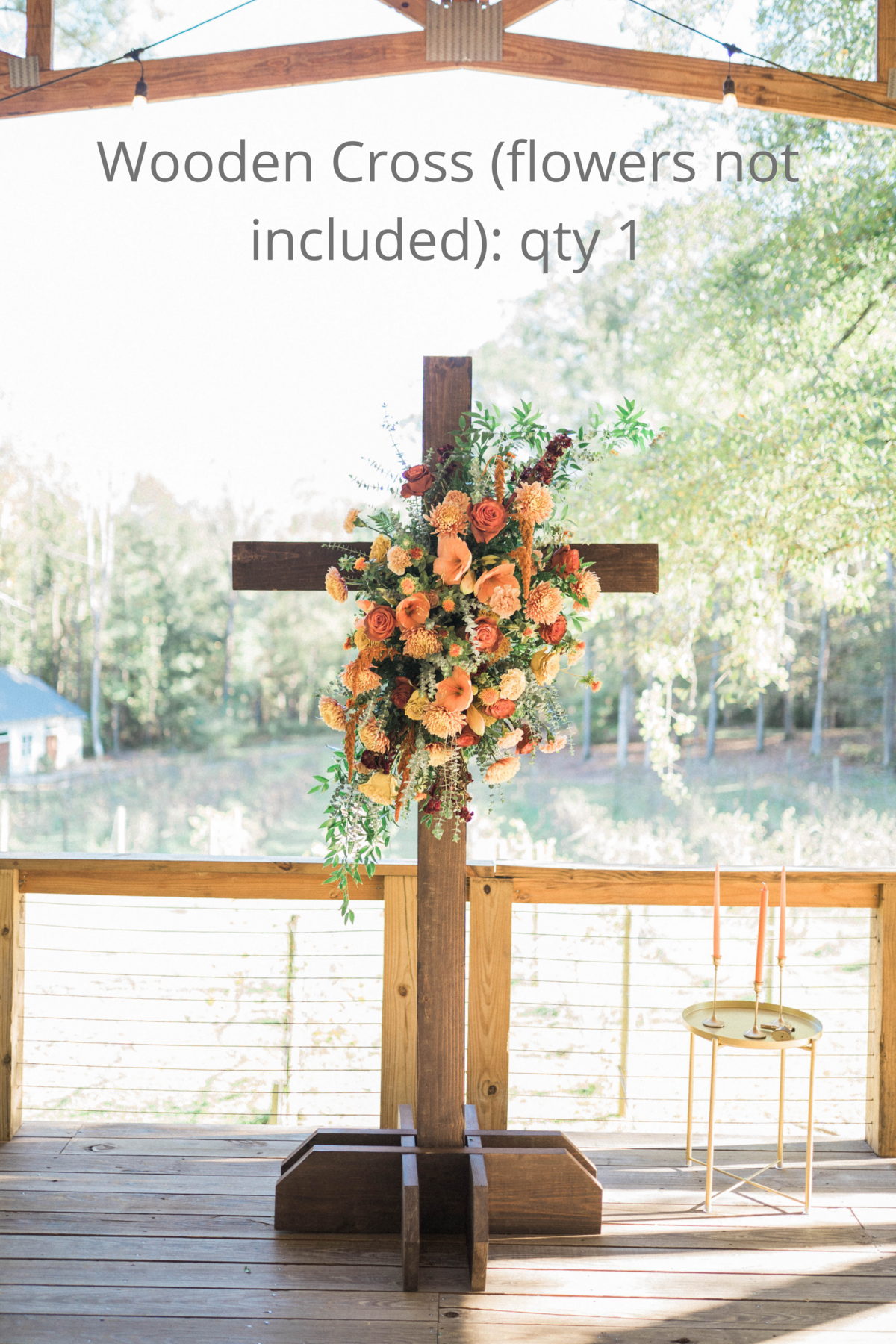 wooden cross with flowers on it