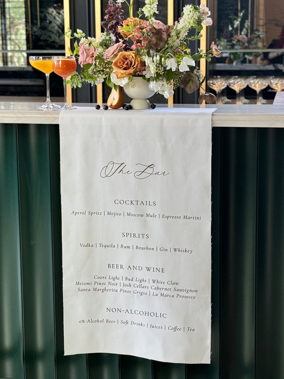 Fabric bar sign with modern typography and script accents