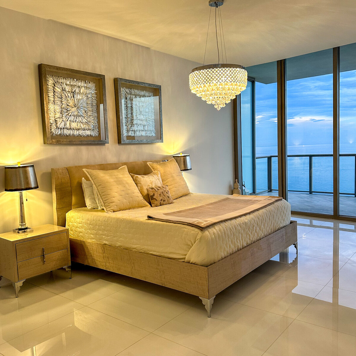 Elegant master bedroom with water views and designer lighting at PH-888, St. Regis Bal Harbour