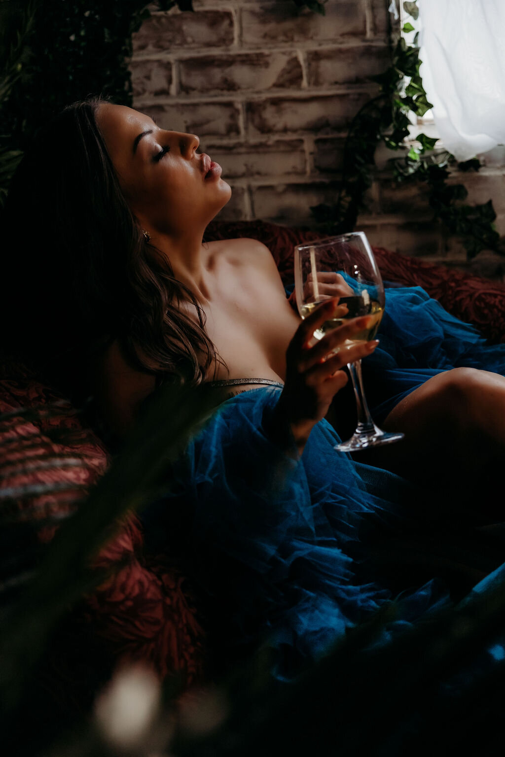 Boudoir photography woman in blue robe on couch Lubbock, Texas Boudoir photographer in Amarillo TX