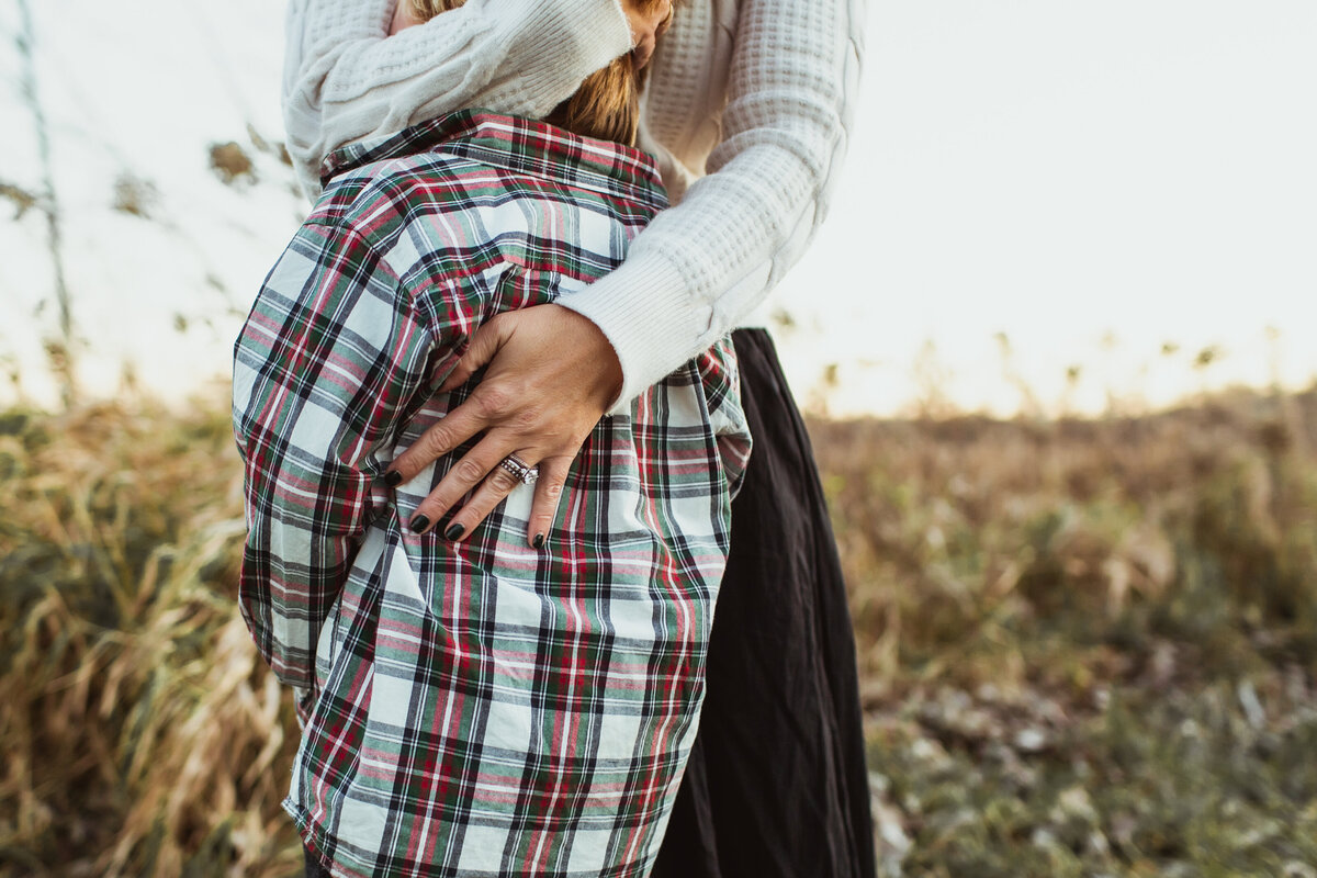 Mother's loving hands on her son.