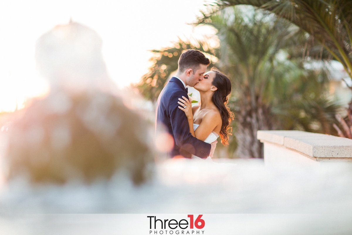 Bride and Groom share a quiet tender kiss together